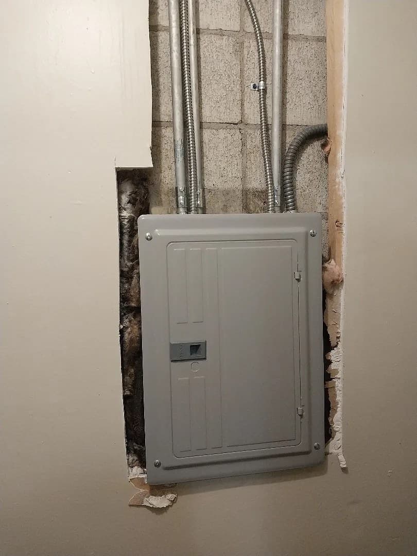 Open electrical panel being serviced